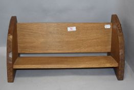 A oak book trough in the Robert Thompson styles having mouse to side.