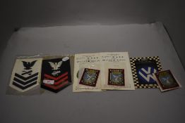 A selection of sew on cloth patches including US Navy and VW