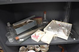 A selection of scientific chemistry equipment mostly glass vessels and test tubes etc