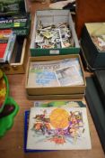 A selection of collectable cigarette and tea card albums and loose leaf cards