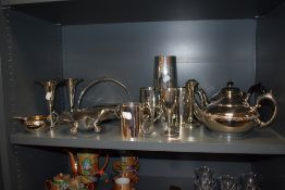 A selection of silver plated metal wares including tankards, teapots and fruit bowls