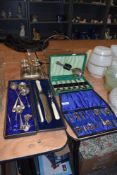 A selection of cased table wares and cutlery including art deco glass and chrome cake stand