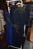Two ladies vintage dresses.