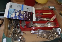 A selection of loose table wares and cutlery including knife stands and vesta case