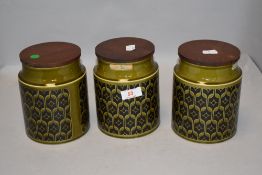 Three mid century kitchen storage jars by Hornsea Pottery in the Heirloom pattern