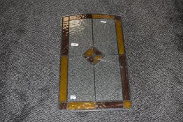 A piece of vintage leaded light window
