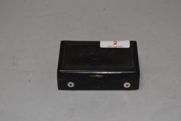 An Edwardian pocket size music box having tortoise shell case