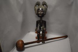 An African carved and stained wood fertility figure, possibly Ashanti, together with a South African