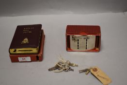Two 20th century penny savings money banks both for District Bank ltd