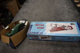 A boxed precision mitre saw and a Parkside electric sander