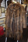A full length fur coat, around 1930s and a 1950s Coney stole with pockets to ends.