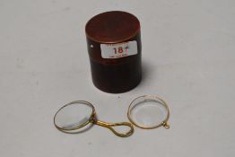 Two early 20th century optical monocle one having grip handle both in yellow metal frames with case