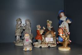 A selection of figures and figurines including Staffordshire style and bisque glazed