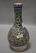 An antique Islamic slender neck vase having an Iznik style pattern