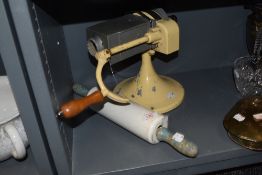 Two pieces of vintage kitchenalia including Butapatta Butter Patting machine and a ceramic rolling