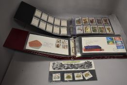 Two bound sets of first day covers stamp collectors packs