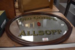 A vintage advertising mirror for Ind Coope Allsopp brand beers with mahogany frame