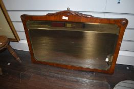 A Victorian over mantle mirror having bevel edged glass with mahogany frame