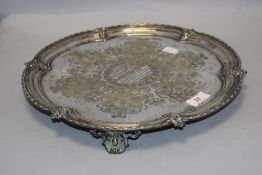 A Victorian silver plated salver, of lobed circular form with moulded rim and booge enclosing