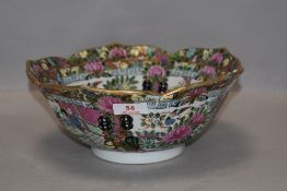 A hard paste Chinese bowl in a lotus flower shape with a Cantonese pattern