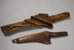 Two antique carved distaffs or knitting sticks