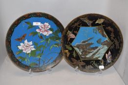 Two Chinese cloisonné enamel plates, 20th century, one decorated with flowers within a repeating