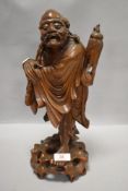 A late 19th/early 20th century Chinese carved boxwood figure, depicting one of the eight Taoist