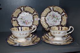 A Victorian pottery tea cup trio set having cobalt blue and gilt decoration with painted floral