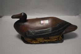 An antique wooden decoy.