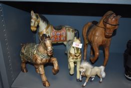 Five 20th century horse figures including wooden carved and hand painted and leather clad