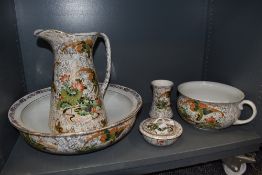 A stunning wash jug and bowl set by Phoenix ware having a chintz style design with Chinoiserie