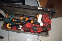 A set of traditional bagpipes, in wooden travel box