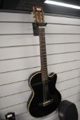 A Westcoast solid Slim Electro Nylon Guitar In Black, looks similar to the Yamaha AEX 500 which is