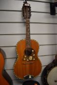 An early 20th Century guitar shaped mandolin , in later padded gig bag