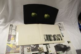 A low numbered top opening Beatles White album with poster - decent copy in VG+ / VG+ vinyl and