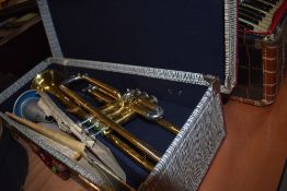 A vintage Selmer student brass trumpet, in semi hard case, bit of surface rust but valves ok,