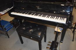 A Roland HP109 digital grand piano and adjustable stool