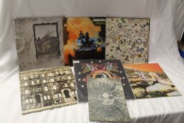 A six album lot with Uriah Heep , Led Zeppelin and Hawkwind with the booklet on offer here