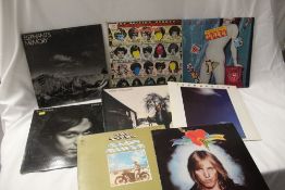 An eight album lot with records by the Rolling Stones , Tom Petty and more on offer here