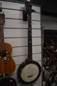 A late 19th or early 20th Century 5 string banjo , stamped J E Dallas, 415 Strand. Serial number