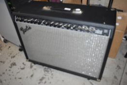 A Fender Ultimate Chorus guitar amplifier, type PR204, serial number CR-028902, with footswitch etc