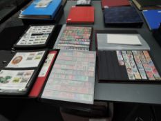 Three stock books of World Stamps, mainly used , mainly modern along with a album of World Railway