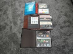 Three albums and a folder of Royal Mail Presentation packs, 1986-1993, 2002-2006 and 2020