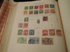 A Whitfield King & Co Standard Stamp Album, third edition, part one mainly empty, part two