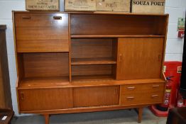 A teak sideboard of stylised design , width approx. 183cm