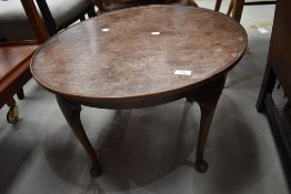 An early 20th Century mahogany coffee table having cabriole legs