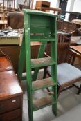 A set of traditional wooden step ladders