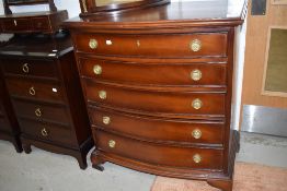 A reproduction bow fronted chest of five long drawers, in the Regency style, width approx. 80cm