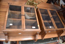 Two early 20th Century oak small wall cabinets