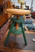A modern beech and painted adjustable stool